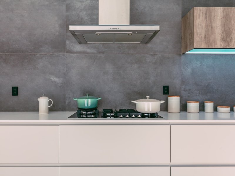 Grey distressed tiles on kitchen wall